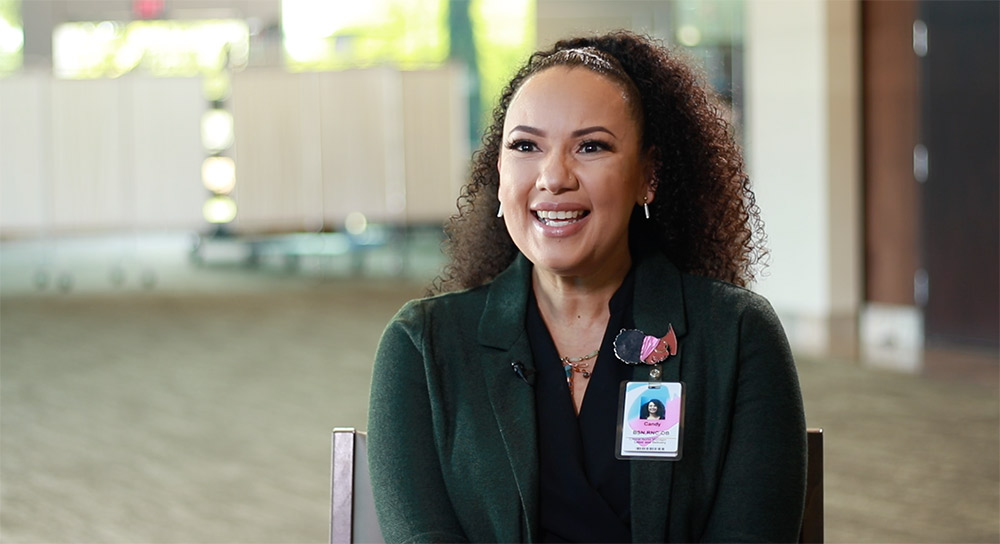 A woman smiles in an interview