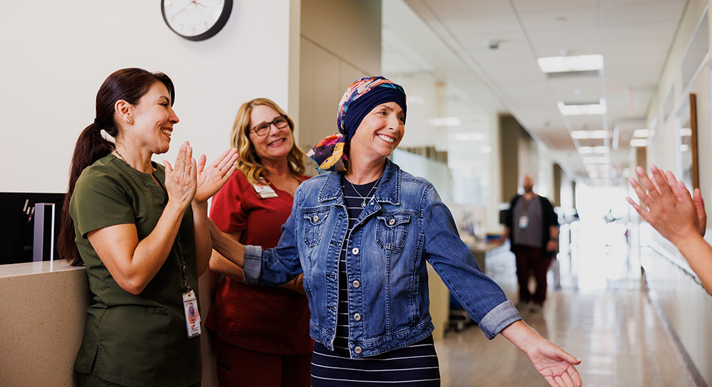 a group of women standing in a hallway