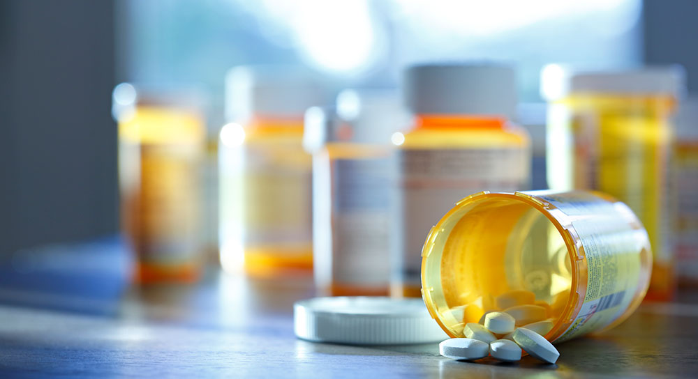 A variety of pill bottles are shown