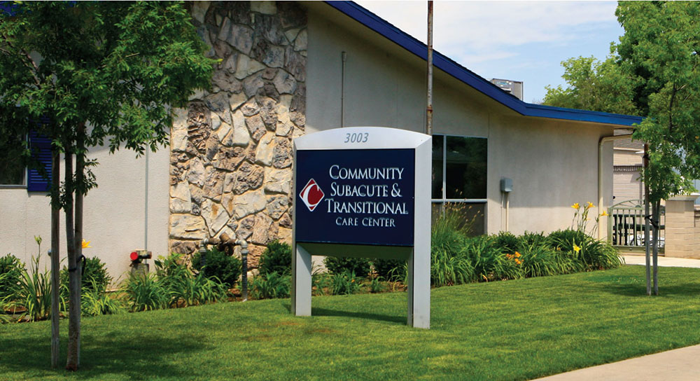 One-story building with sign reading "Community Subacute Transitional Care Center"