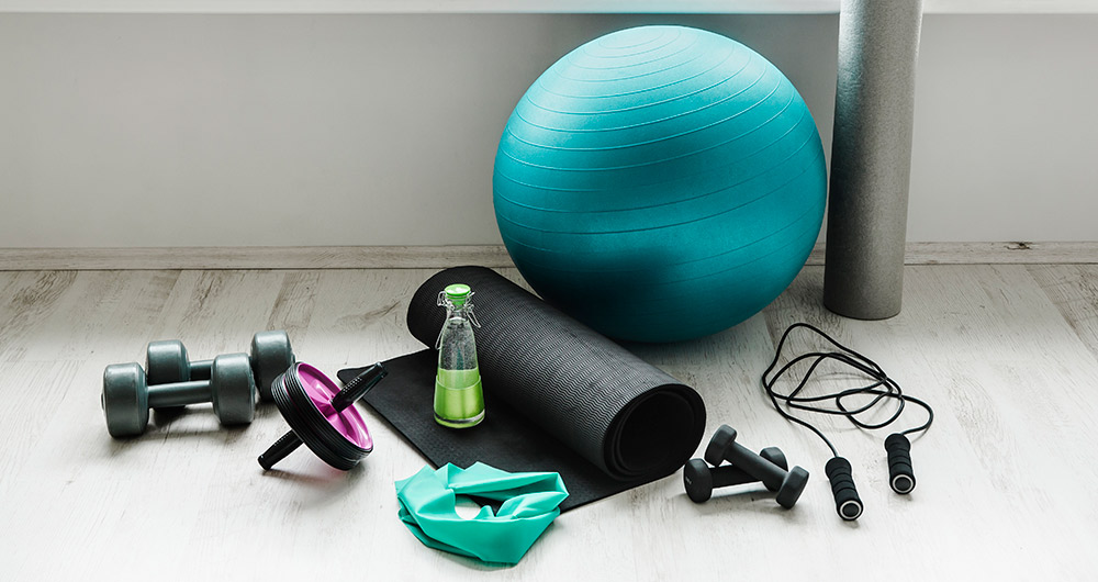 Exercise equipment rests on the floor of a gym
