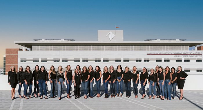 founders club women wearing black shirts and blue jeans