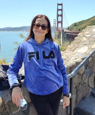 Adriana Castillo poses in front of the Golden Gate Bridge