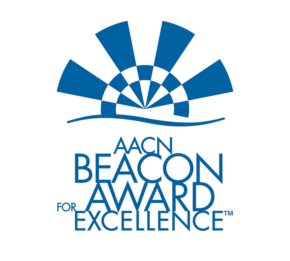 Texto azul sobre fondo blanco: ​​​​​​​Beacon Award for Excellence de la AACN