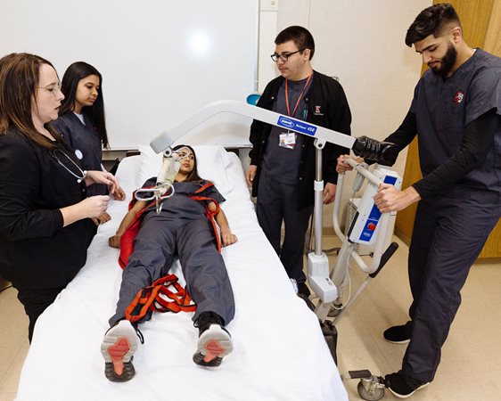 Kerman High School medical students using medical equipment