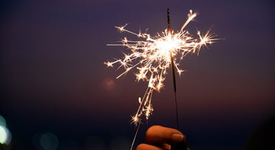 close-up of a sparkler against a dark sky