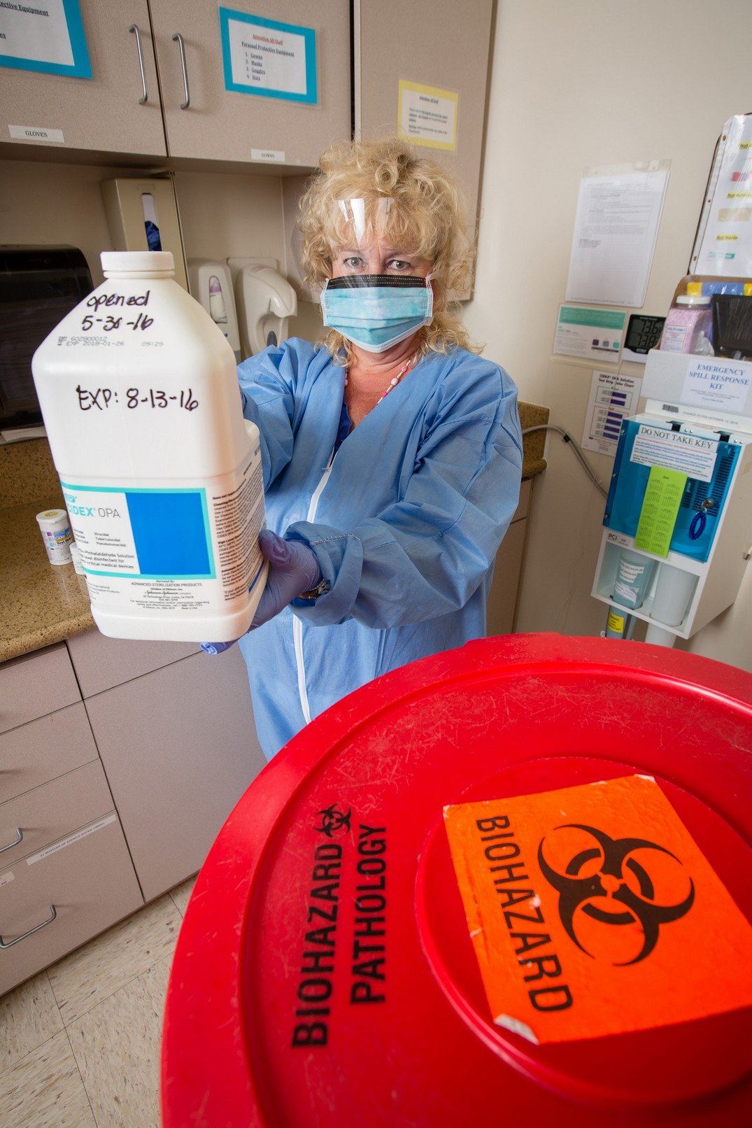 Community Regional’s Environmental Safety Officer, Camille Boone, demonstrates how employees must suit up before using toxic Glutaraldehyde.