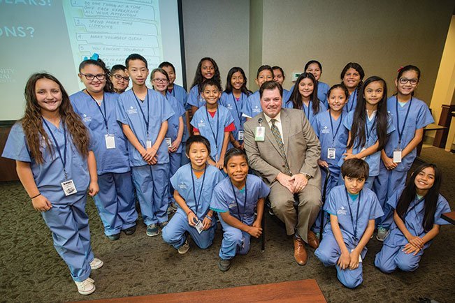 Craig Wagoner, CEO of Community Medical Centers’ facilities, poses with some of the Birney Elementary students who participated in a hospital tour this past fall.