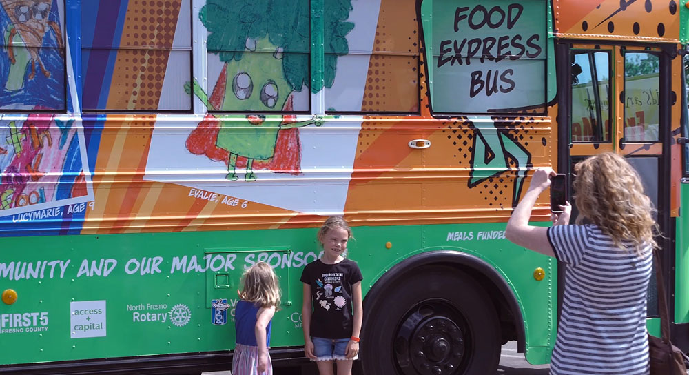 Mobile Meal Bus Feeds Needy Children During School Breaks