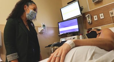 Nurse Candy Zaranyika chats with a patient